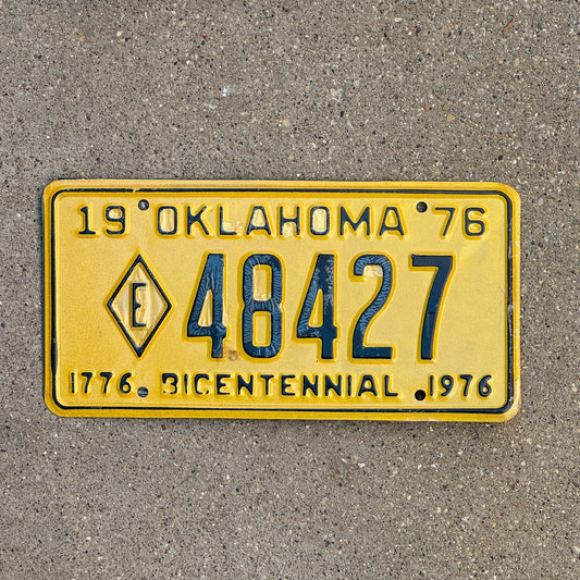 Photo of a 1976 Oklahoma Exempt License Plate Auto Tag Garage Decor Vintage Diamond E Fire State Police 48427 with original patina