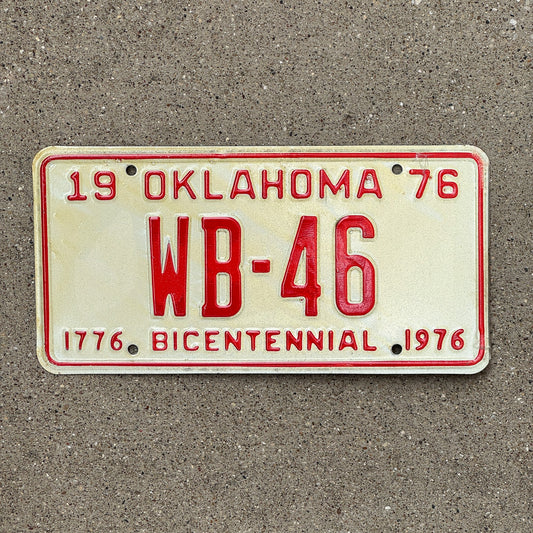 Photo of a 1976 Oklahoma License Plate Auto Tag Garage Decor Vintage Bicentennial Low Number Two Digit WB 46 with original patina