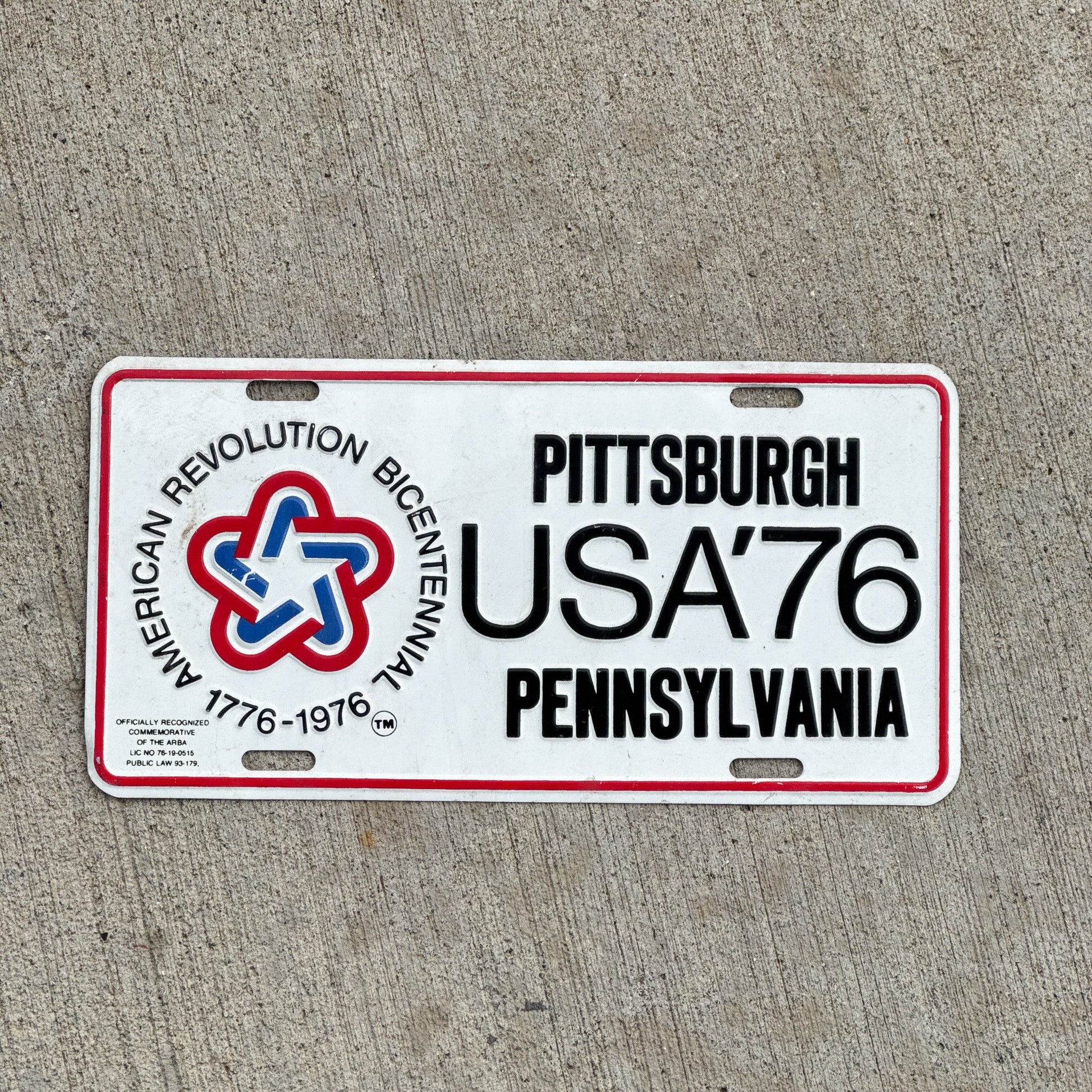 Photo of a 1976 Pennsylvania Booster License Plate Auto Tag Garage Decor Vintage American Revolution Bicentennial Pittsburgh USA '76 with original patina