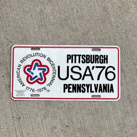 Photo of a 1976 Pennsylvania Booster License Plate Auto Tag Garage Decor Vintage American Revolution Bicentennial Pittsburgh USA '76 with original patina