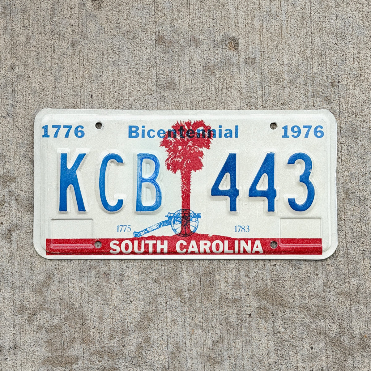 Photo of a 1976 South Carolina License Plate Auto Tag Garage Decor Vintage Bicentennial KCB 443 with original patina
