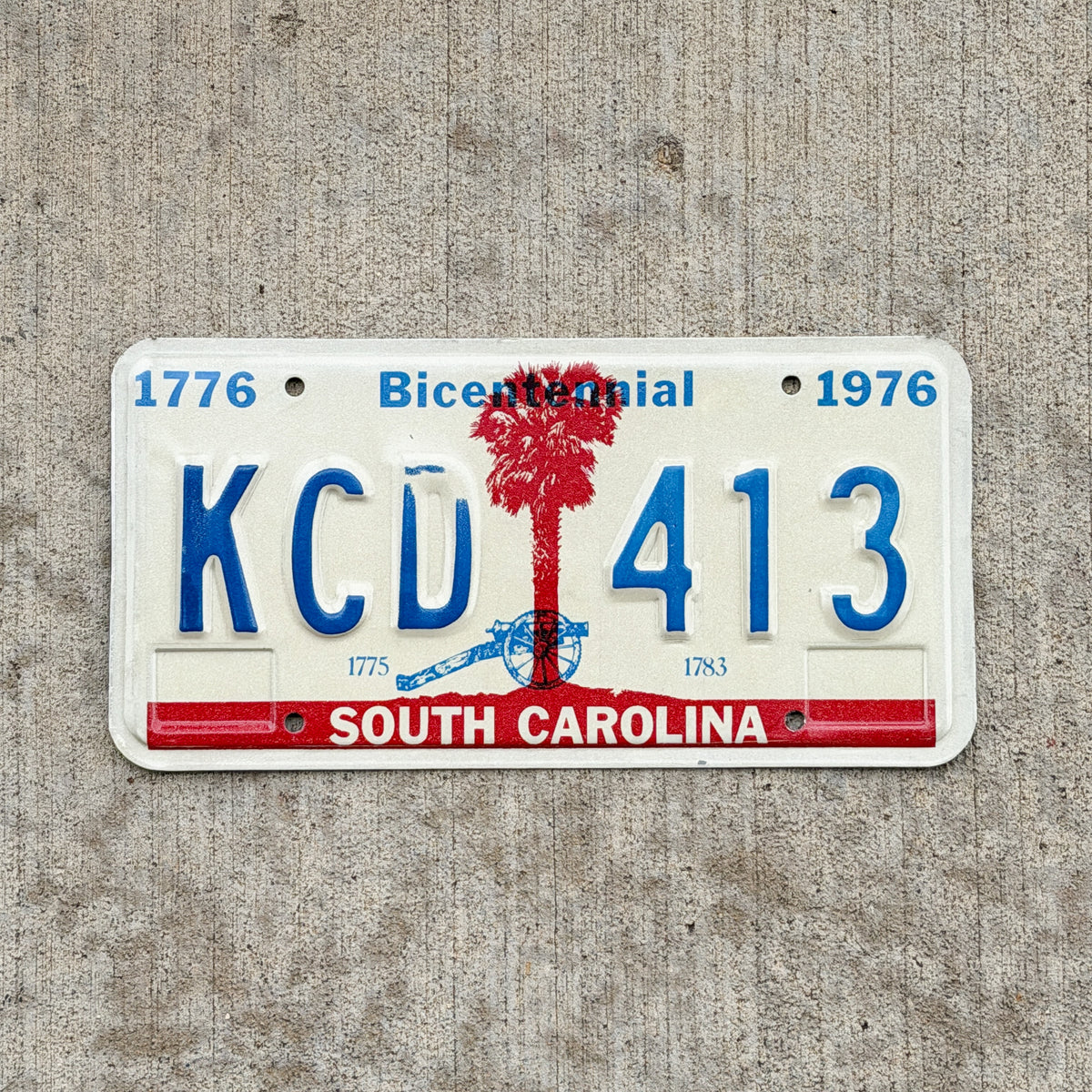 Photo of a 1976 South Carolina License Plate Auto Tag Garage Decor Vintage Bicentennial KCD 413 with original patina