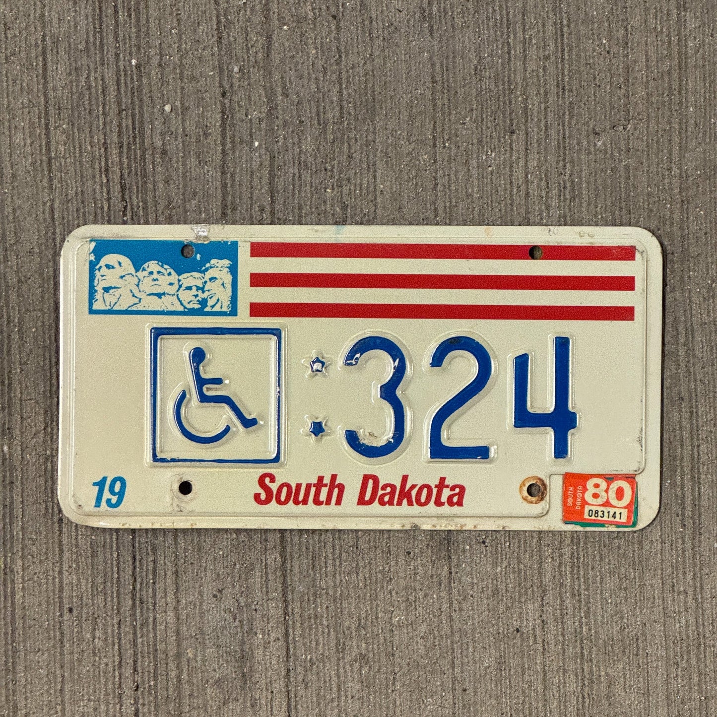Photo of a 1976 South Dakota Handicap License Plate Auto Tag Garage Decor Vintage 324