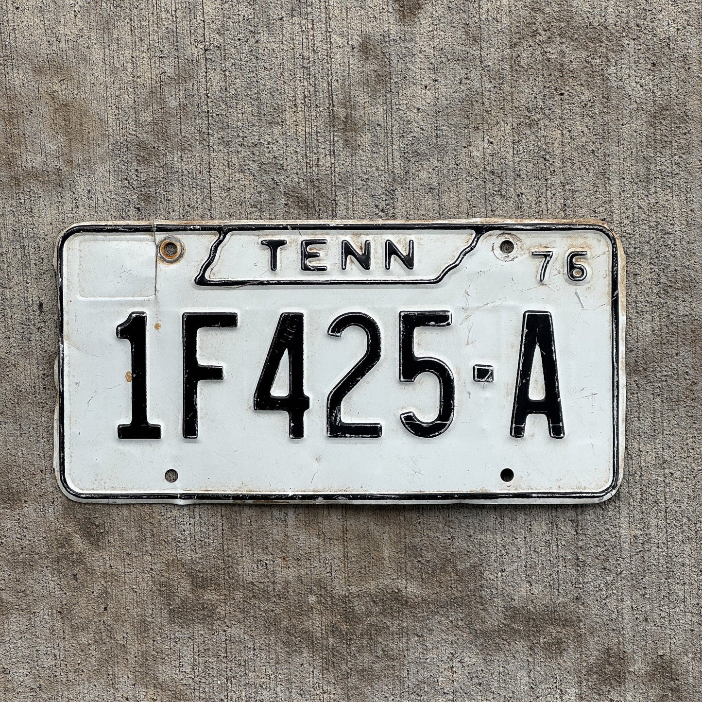 Photo of a 1976 Tennessee Joint Truck License Plate Auto Tag Garage Decor Vintage 1F 425 A with original patina