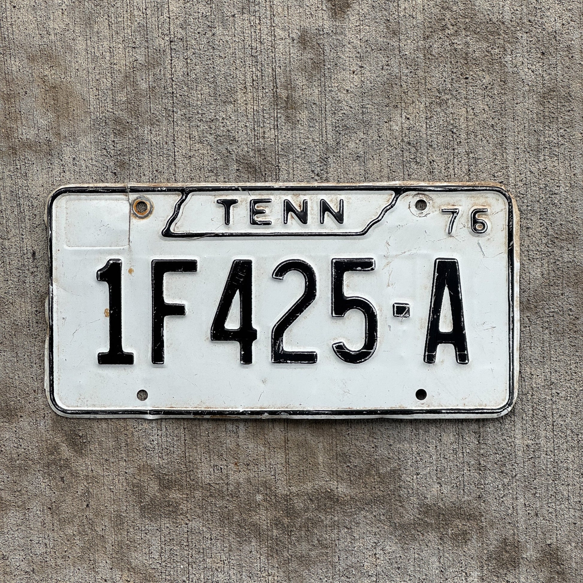 Photo of a 1976 Tennessee Joint Truck License Plate Auto Tag Garage Decor Vintage 1F 425 A with original patina
