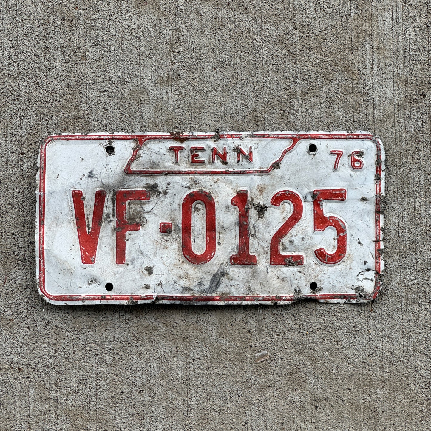 Photo of a 1976 Tennessee Volunteer Firefighter License Plate Auto Tag Garage Decor Vintage VF 0125 with original patina