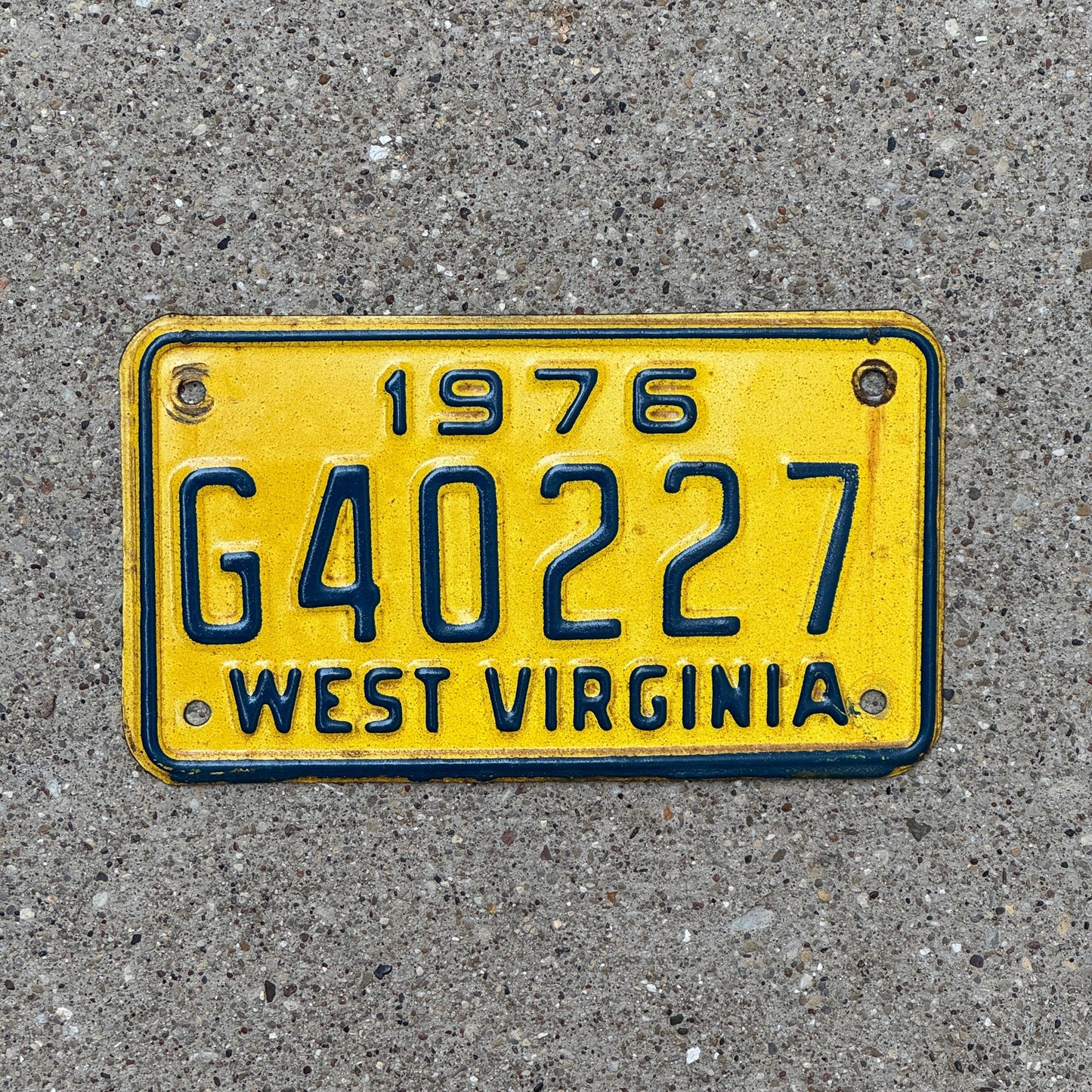 Photo of a 1976 West Virginia Motorcycle License Plate Auto Tag Garage Decor Vintage G 40227 with original patina