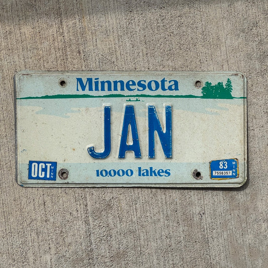 Photo of a 1977 1983 Minnesota Vanity License Plate Auto Tag Garage Decor Vintage Birthday Month Name JAN with original patina