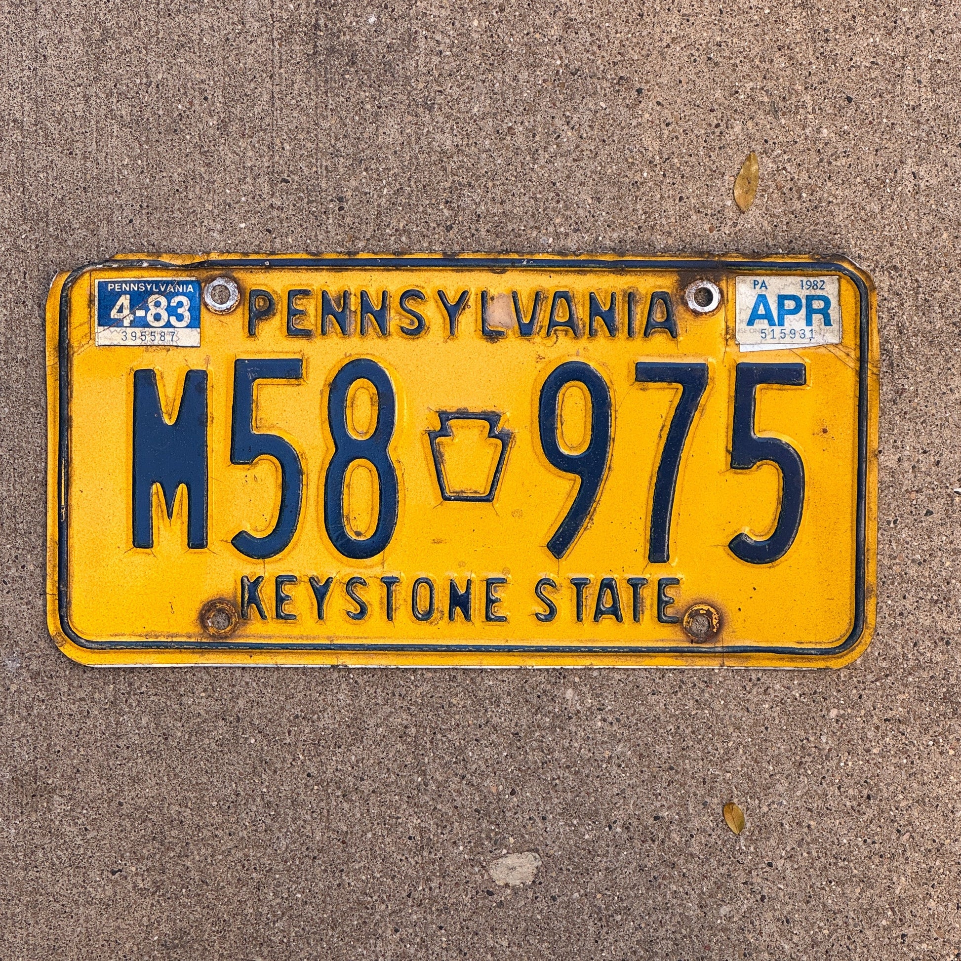Photo of a 1977 1983 Pennsylvania License Plate Auto Tag Garage Decor Vintage M58 975 with original patina