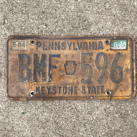 Photo of a 1977 1985 Pennsylvania License Plate Auto Tag Garage Decor Vintage BMF 596 with original patina
