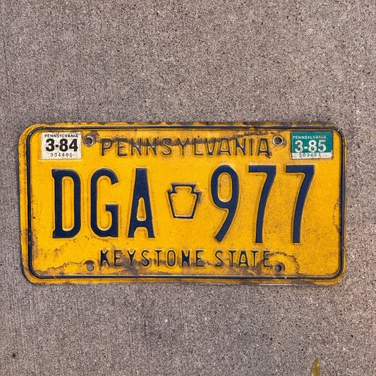 Photo of a 1977 1985 Pennsylvania License Plate Auto Tag Garage Decor Vintage DGA 977 with original patina