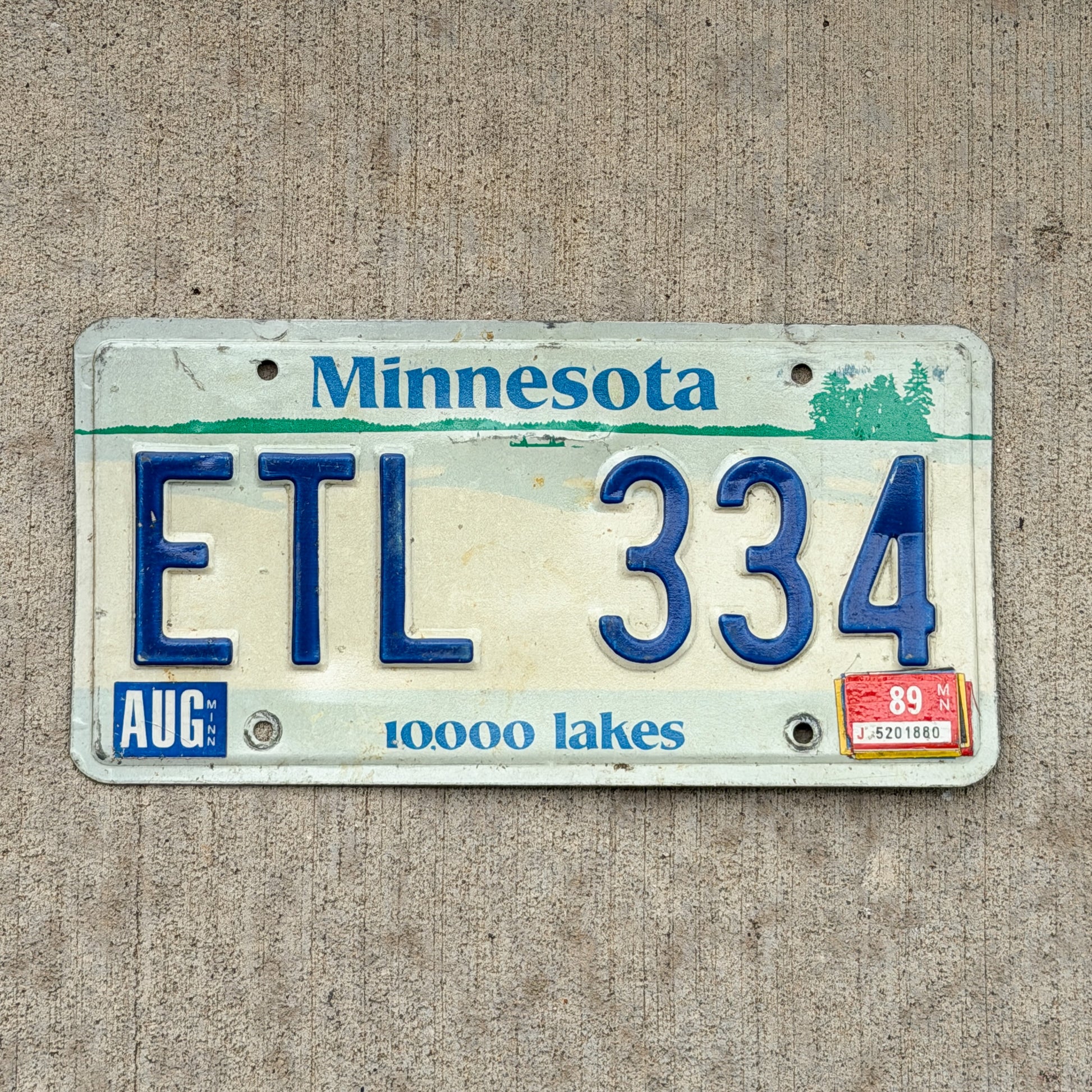Photo of a 1977 1989 Minnesota License Plate Auto Tag Garage Decor Vintage ETL 334 with original patina