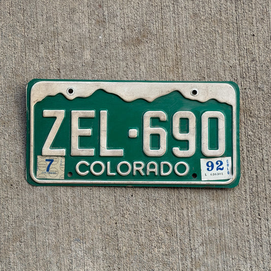 Photo of a 1977 1992 Colorado License Plate Auto Tag Garage Decor Vintage ZEL 690 with original patina