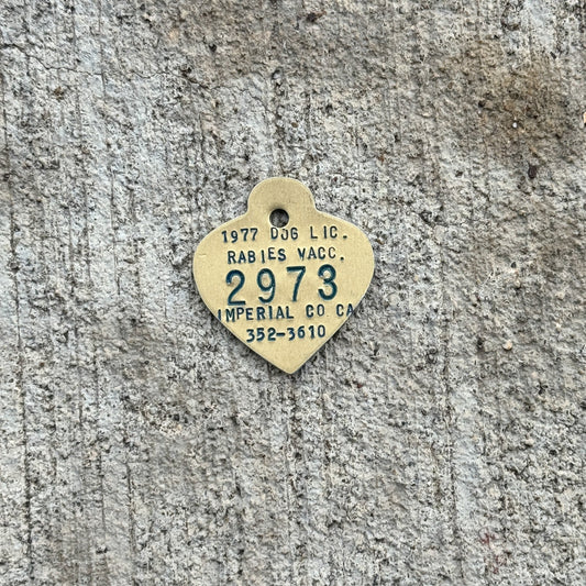 Photo of a 1977 California Dog License Auto Tag Garage Decor Vintage Imperial County 2973 with original patina