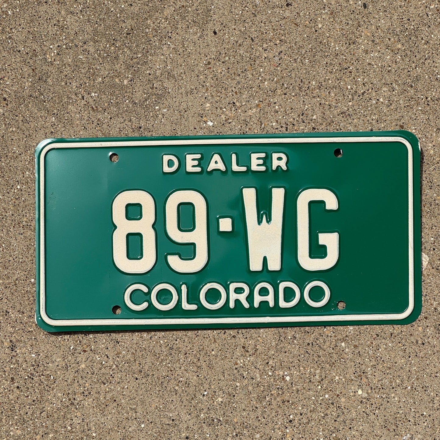Photo of a 1977 Colorado Dealer License Plate Auto Tag 1 Garage Decor 89 WG