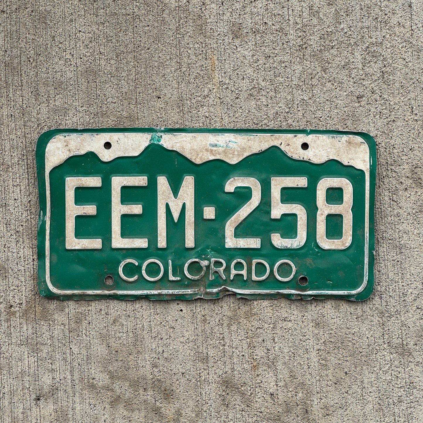 Photo of a 1977 Colorado License Plate Auto Tag Garage Decor Vintage EEM 258 with original patina