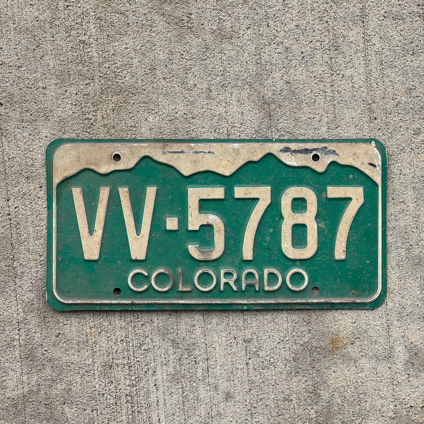Photo of a 1977 Colorado License Plate Auto Tag Garage Decor Vintage VV 5787 with original patina
