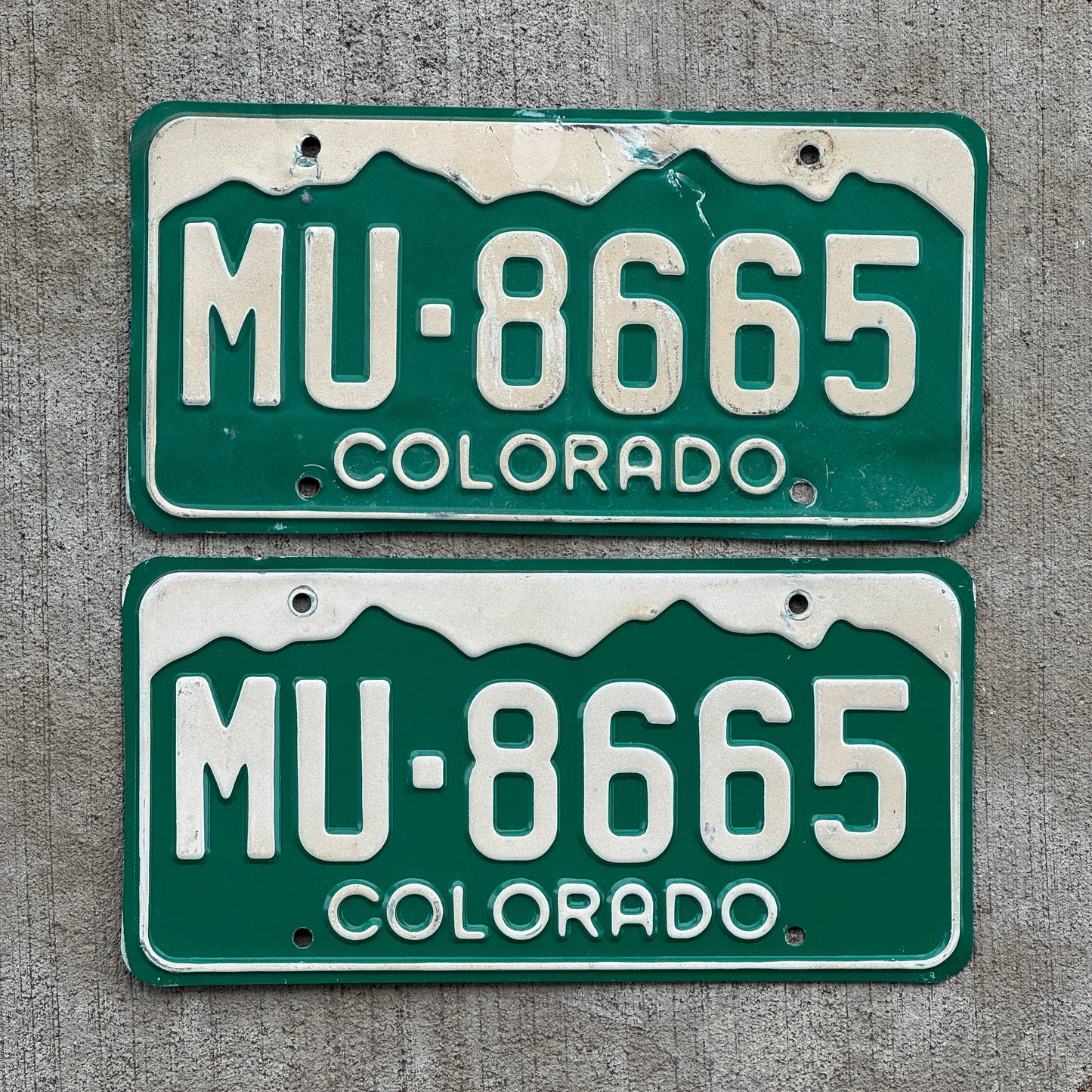 Photo of a 1977 Colorado License Plate Pair Auto Tag Garage Decor Vintage MU 8665 with original patina