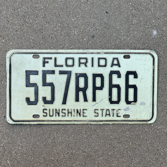 Photo of a 1977 Florida Real Property License Plate Auto Tag Garage Decor Vintage 557 RP 66 with original patina