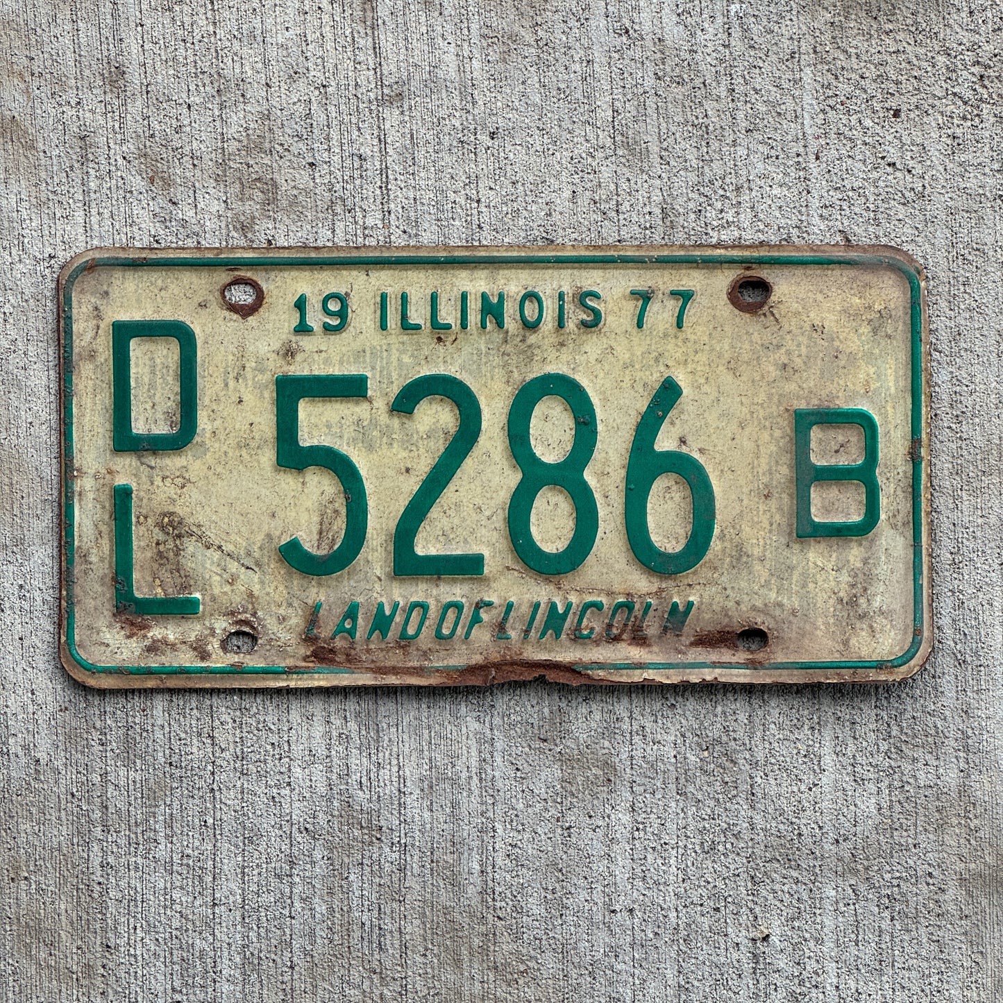 Photo of a 1977 Illinois Dealer License Plate Auto Tag 1 Vintage Garage 5286 B with original patina
