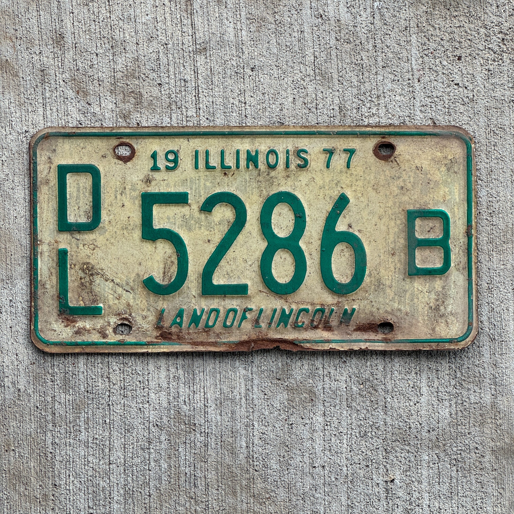 Photo of a 1977 Illinois Dealer License Plate Auto Tag 1 Vintage Garage 5286 B with original patina
