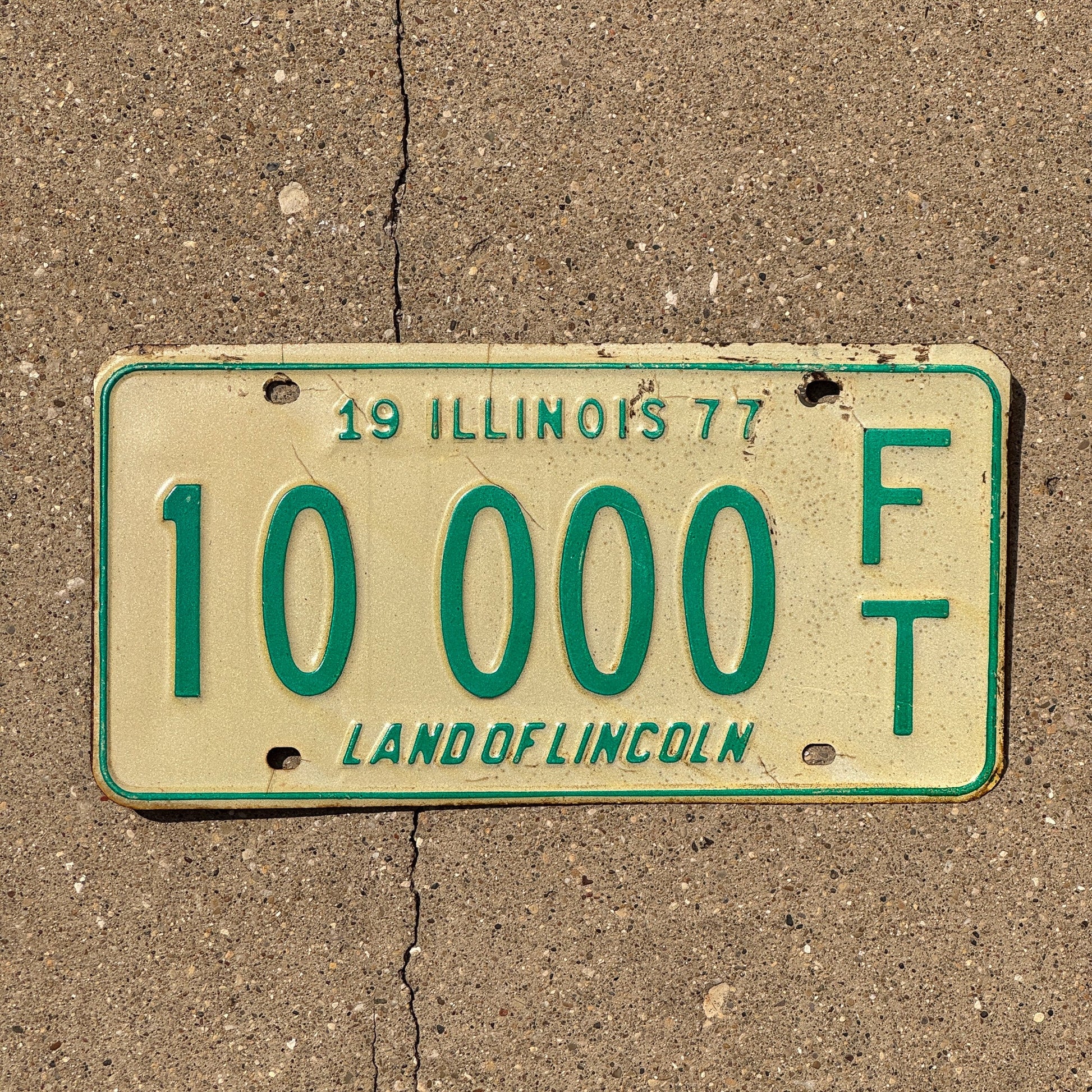 Photo of a 1977 Illinois Fertilizer Trailer License Plate Auto Tag Garage Decor Vintage 10000 FT