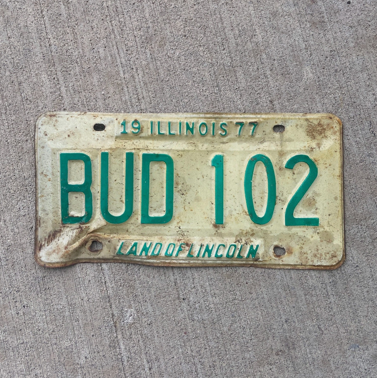 Photo of a 1977 Illinois License Plate Auto Tag 1 Vintage Garage 420 Weed Pot Smoke BUD 102 with original patina