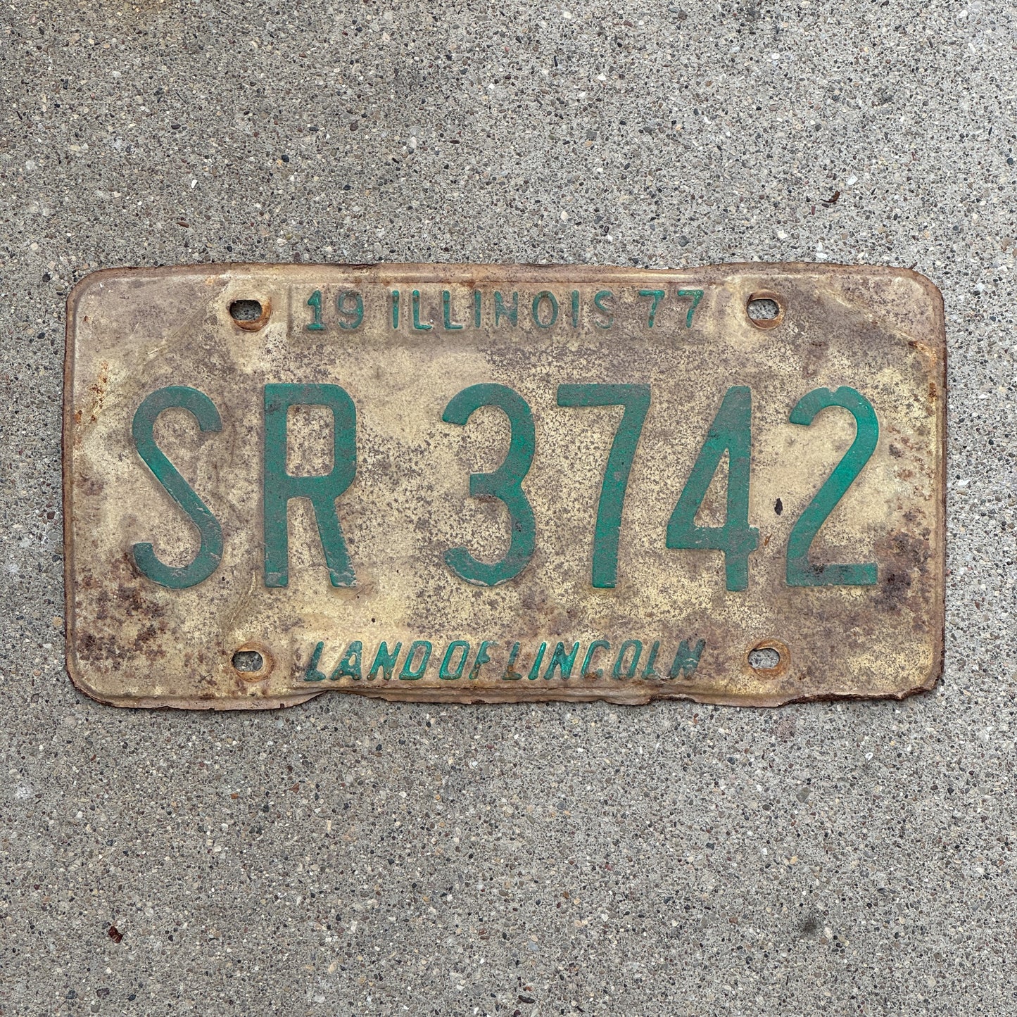 Photo of a 1977 Illinois License Plate Auto Tag 1 Vintage Garage SR 3742 with original patina