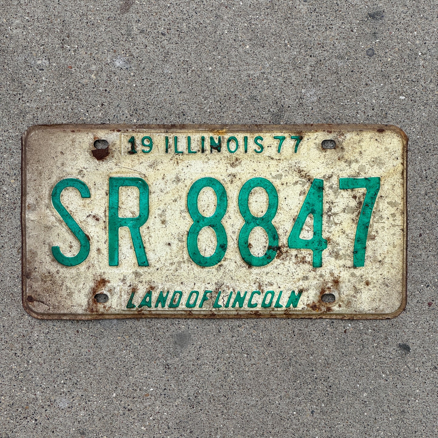 Photo of a 1977 Illinois License Plate Auto Tag 1 Vintage Garage SR 8847 with original patina