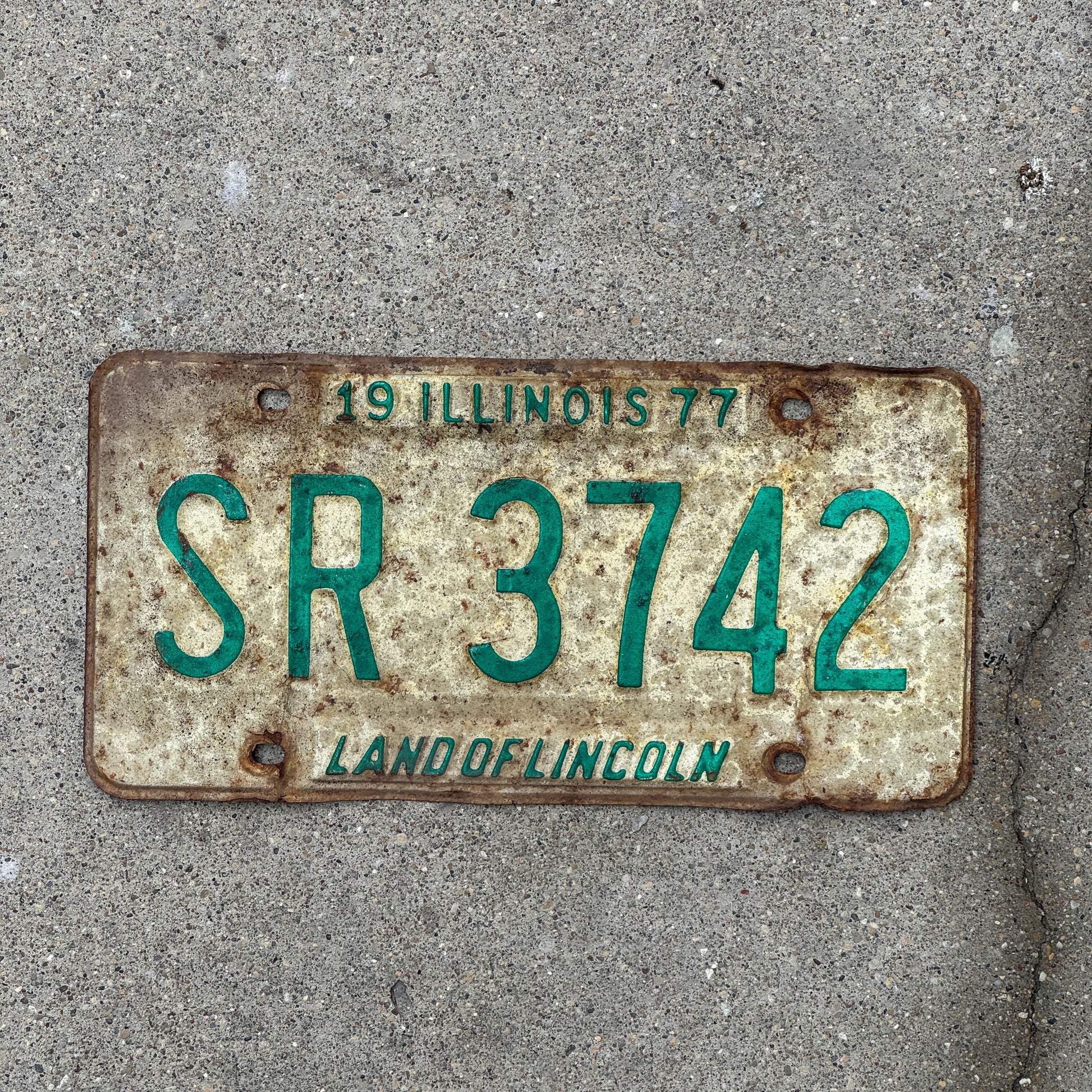 Photo of a 1977 Illinois License Plate Auto Tag 2 Vintage Garage SR 3742 with original patina
