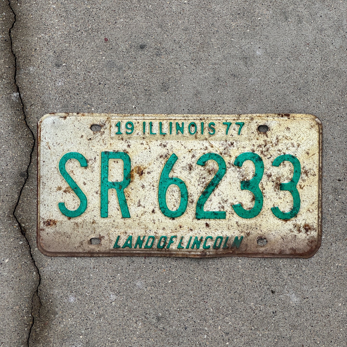 Photo of a 1977 Illinois License Plate Auto Tag 2 Vintage Garage SR 6233 with original patina
