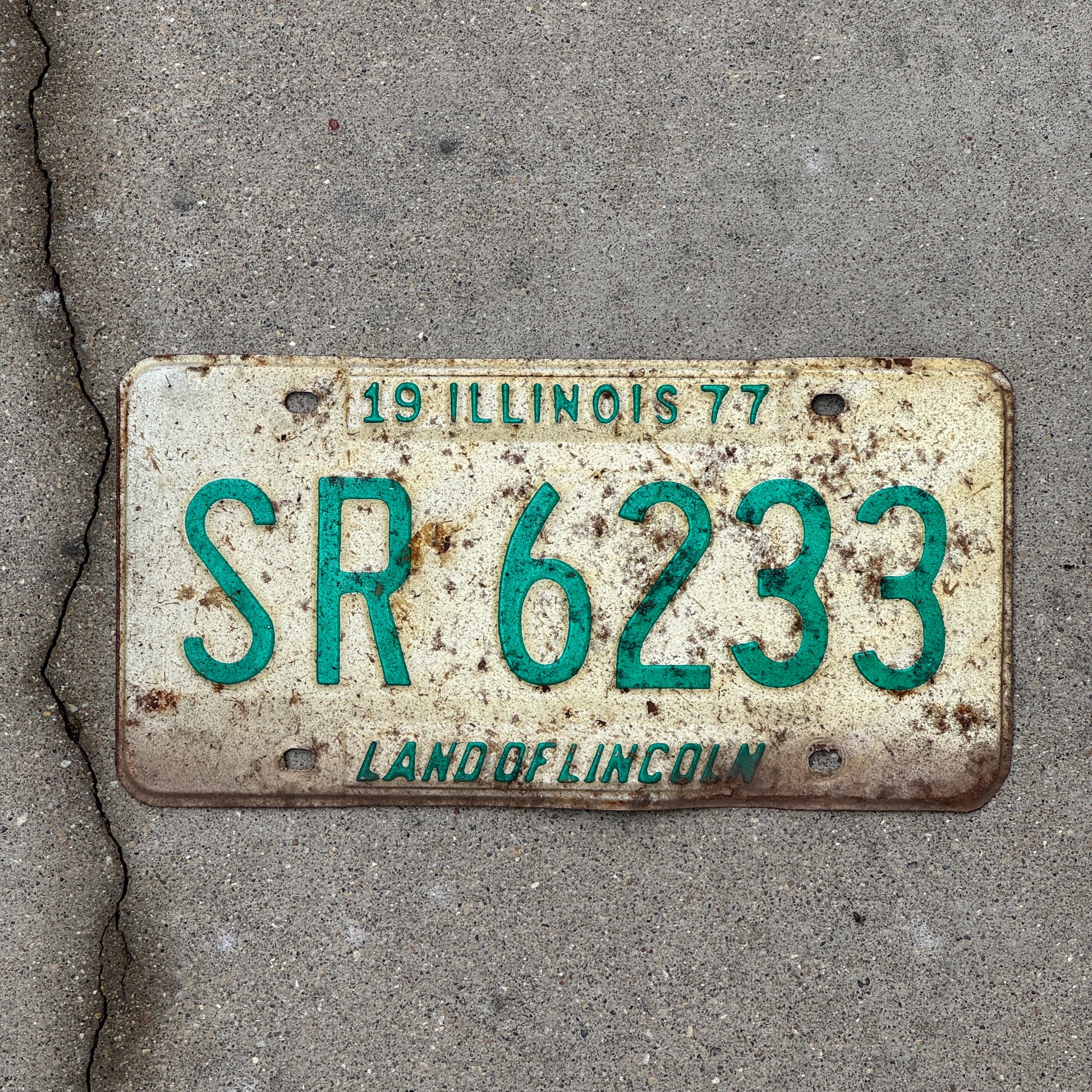 Photo of a 1977 Illinois License Plate Auto Tag 2 Vintage Garage SR 6233 with original patina