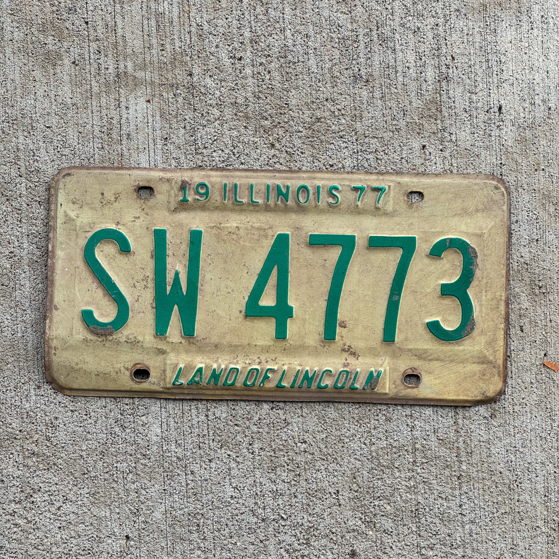 Photo of a 1977 Illinois License Plate Auto Tag 2 Vintage Garage SW 4773 with original patina