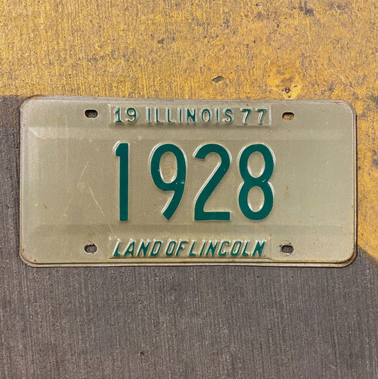 Photo of a 1977 Illinois License Plate Auto Tag Garage Decor Vintage Low Number Four Digit 1928 with original patina