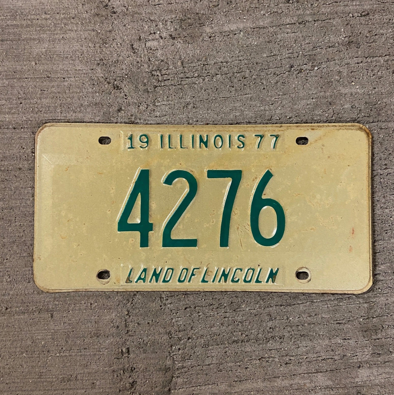 Photo of a 1977 Illinois License Plate Auto Tag Garage Decor Vintage Low Number Four Digit 4276 with original patina