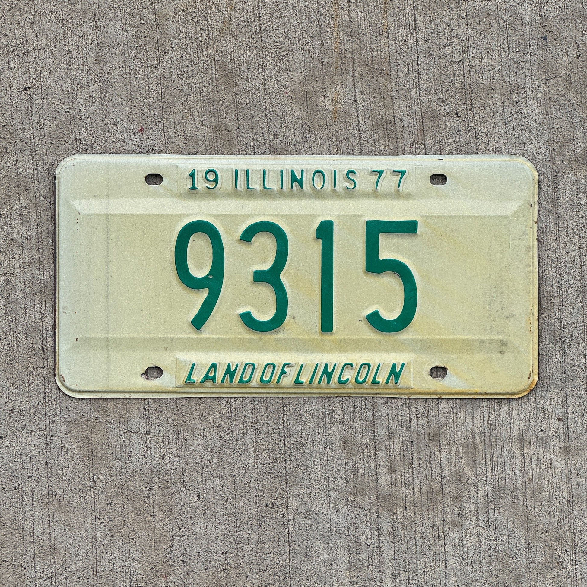 Photo of a 1977 Illinois License Plate Auto Tag Garage Decor Vintage Low Number Four Digit 9315 with original patina