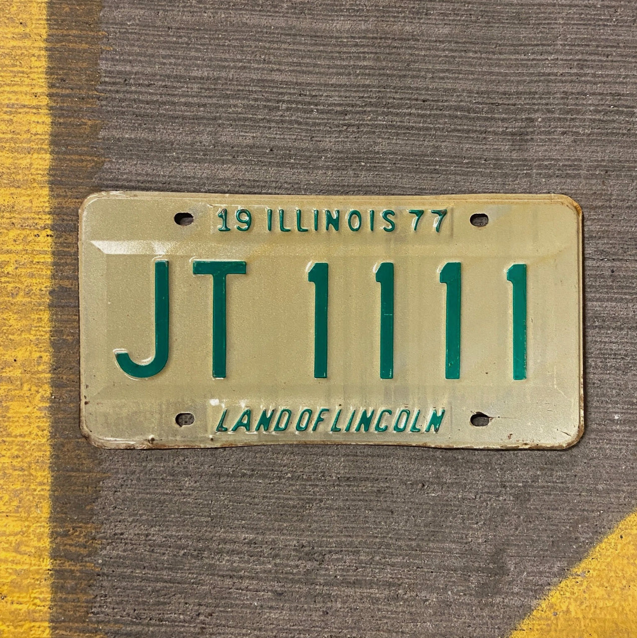 Photo of a 1977 Illinois License Plate Auto Tag Garage Decor Vintage Repeat Repeating JT 1111 with original patina