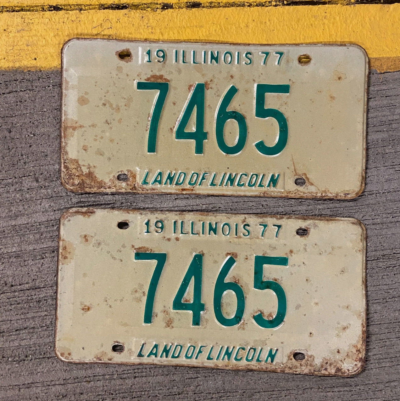 Photo of a 1977 Illinois License Plate Pair Auto Tag Garage Decor Vintage Low Number Four Digit 7465 with original patina