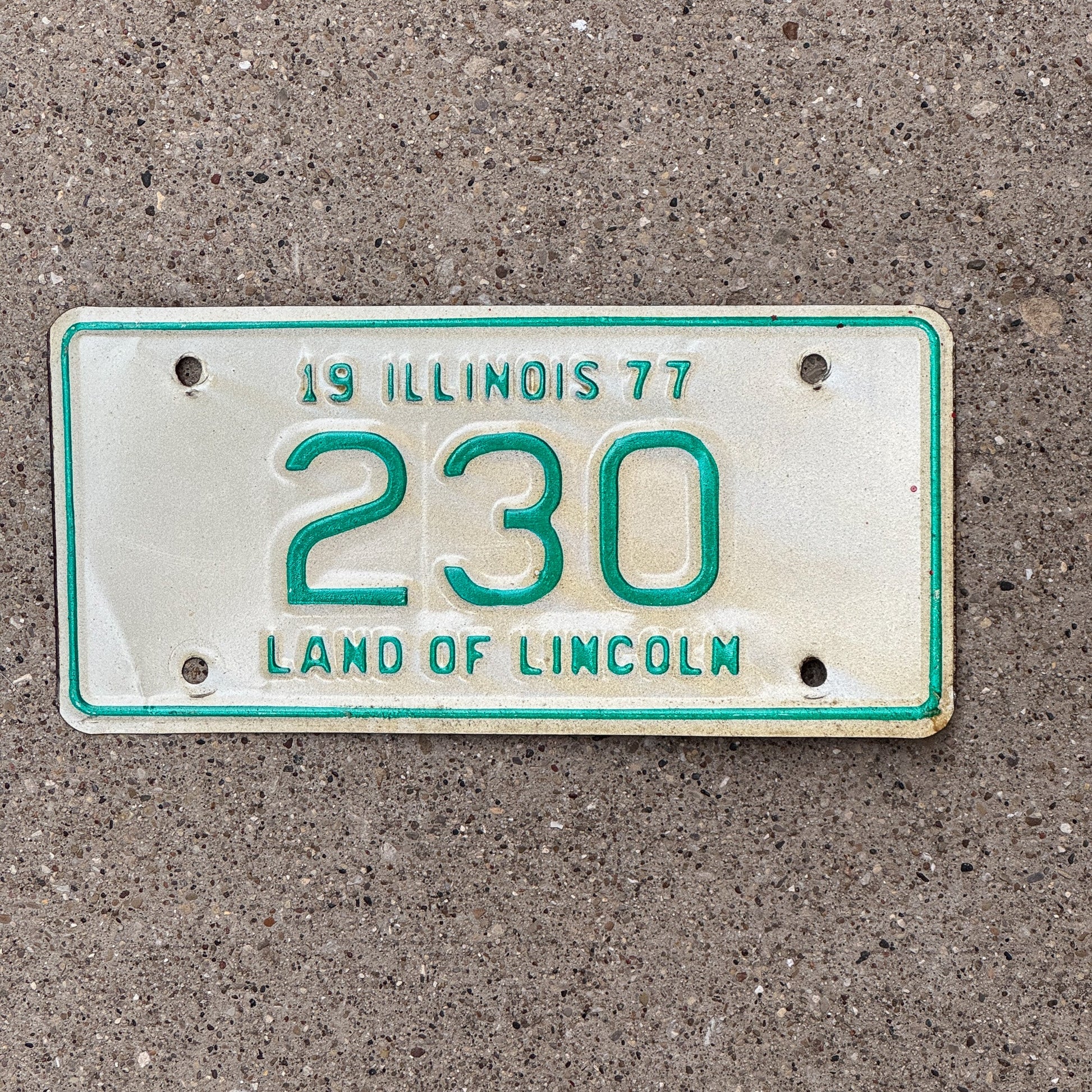 Photo of a 1977 Illinois Motorcycle License Plate Auto Tag Garage Decor Vintage Low Number Three Digit 230 with original patina
