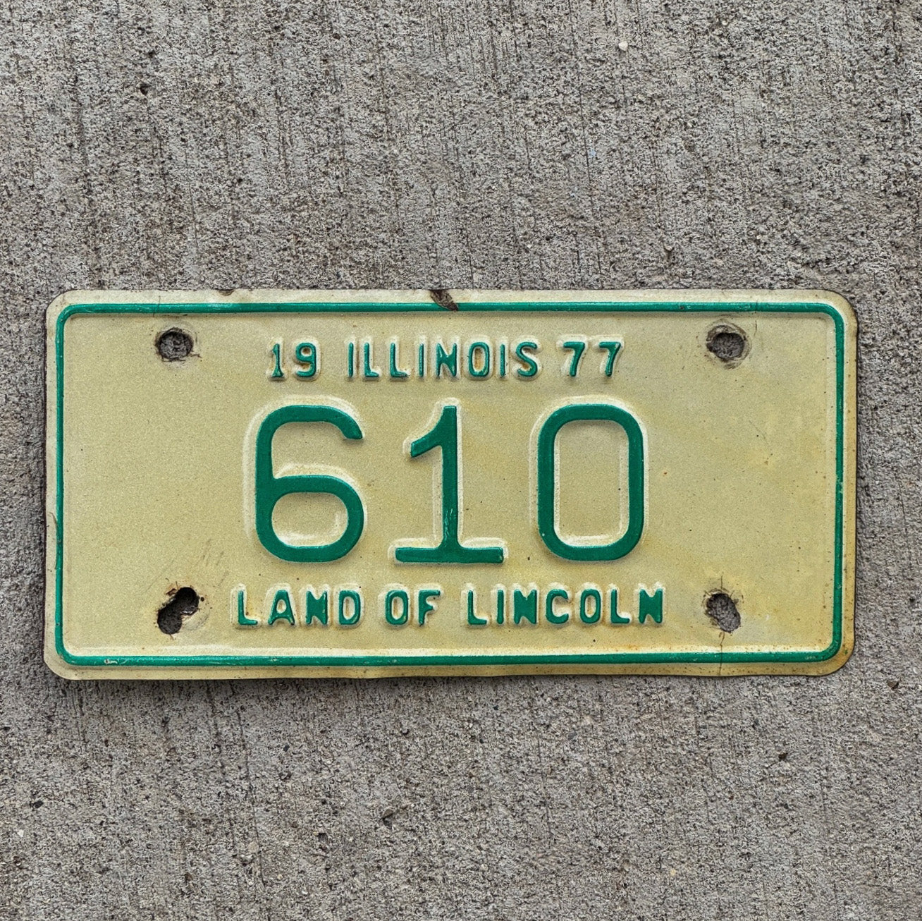 Photo of a 1977 Illinois Motorcycle License Plate Auto Tag Garage Decor Vintage Low Number Three Digit 610 with original patina