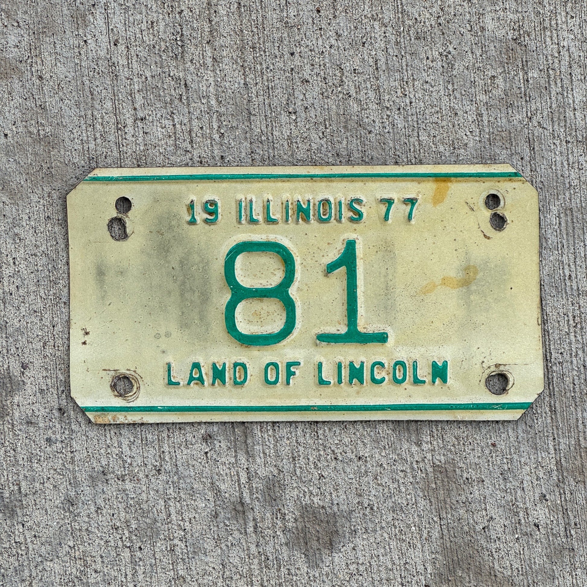 Photo of a 1977 Illinois Motorcycle License Plate Auto Tag Garage Decor Vintage Low Number Two Digit 81 with original patina