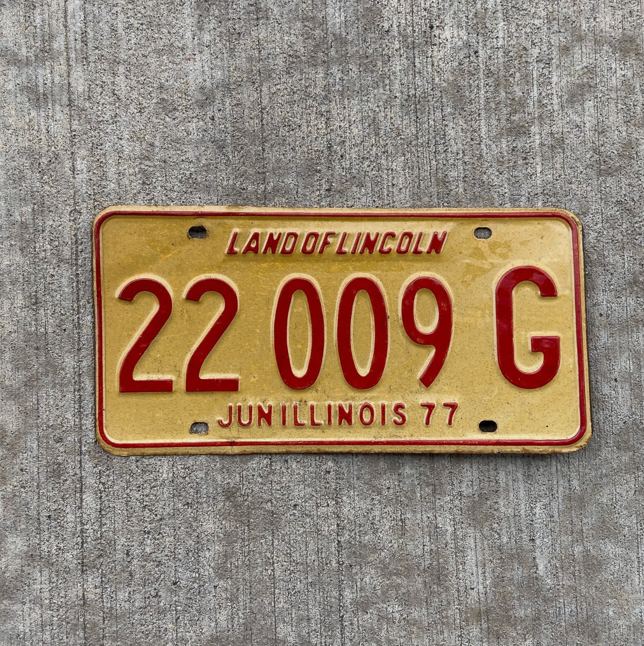 Photo of a 1977 Illinois Truck License Plate Auto Tag Garage Decor Vintage 22009 G with original patina
