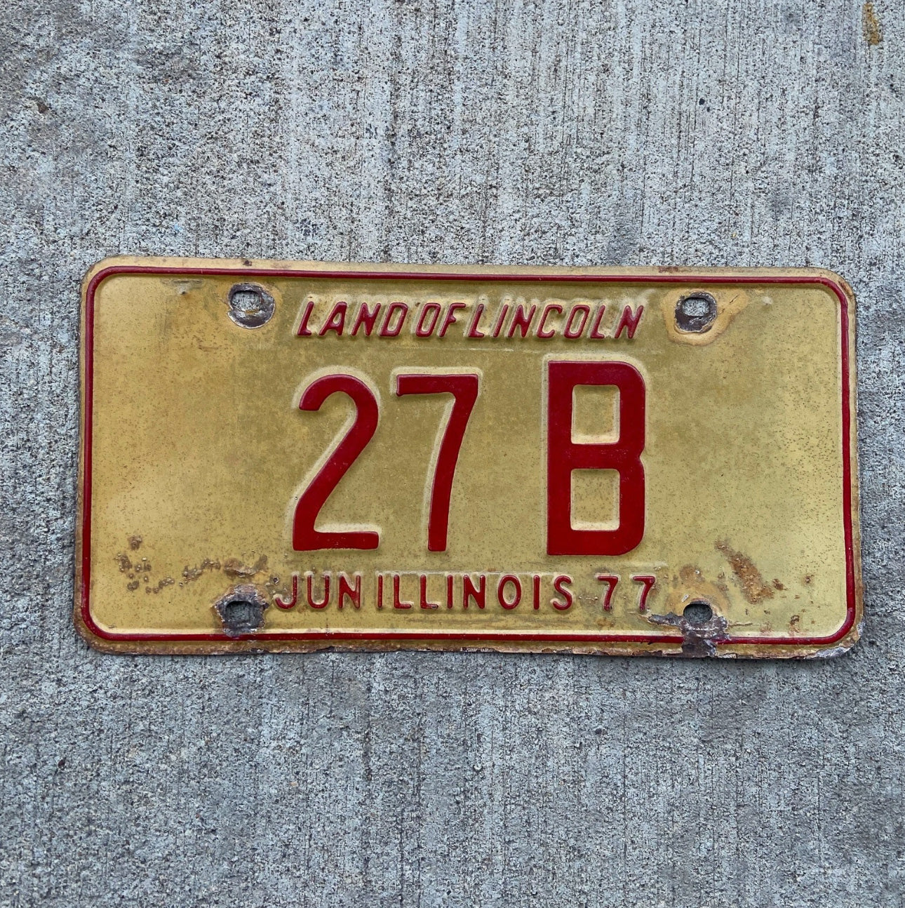 Photo of a 1977 Illinois Truck License Plate Auto Tag Garage Decor Vintage Low Number Two Digit 27 B with original patina