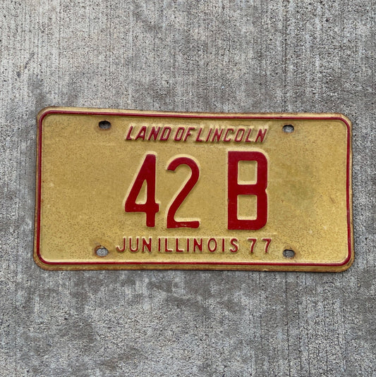Photo of a 1977 Illinois Truck License Plate Auto Tag Garage Decor Vintage Low Number Two Digit 42 B with original patina