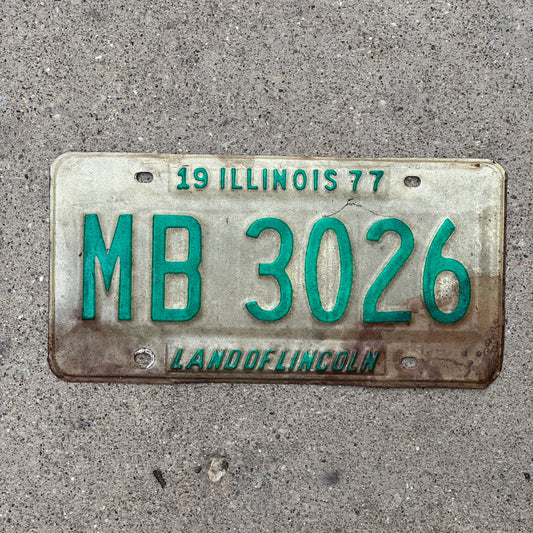 Photo of a 1977 Illinois Truck Mileage Tax License Plate Auto Tag Garage Decor Vintage MB 3026 with original patina