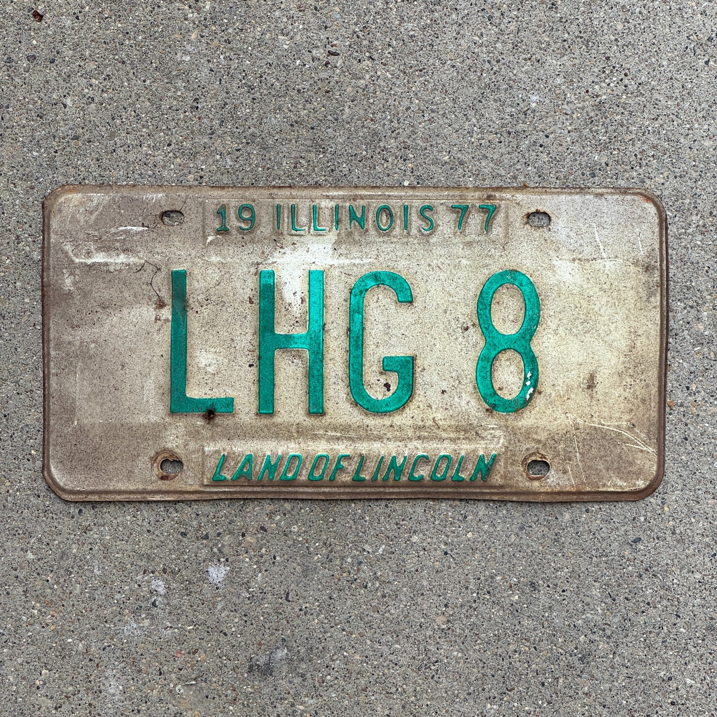 Photo of a 1977 Illinois Vanity License Plate Auto Tag 1 Vintage Garage LHG 8 with original patina