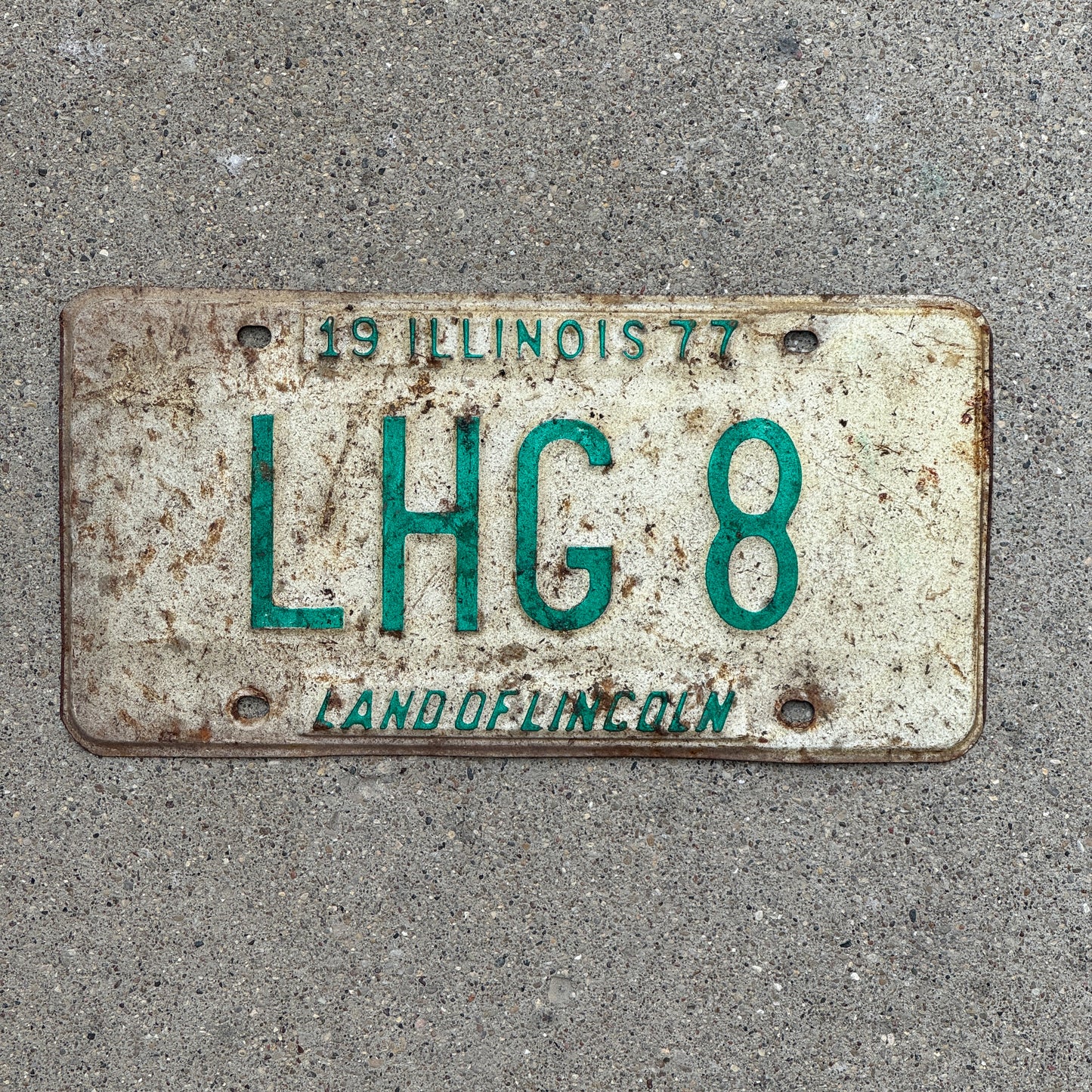 Photo of a 1977 Illinois Vanity License Plate Auto Tag 2 Vintage Garage LHG 8 with original patina
