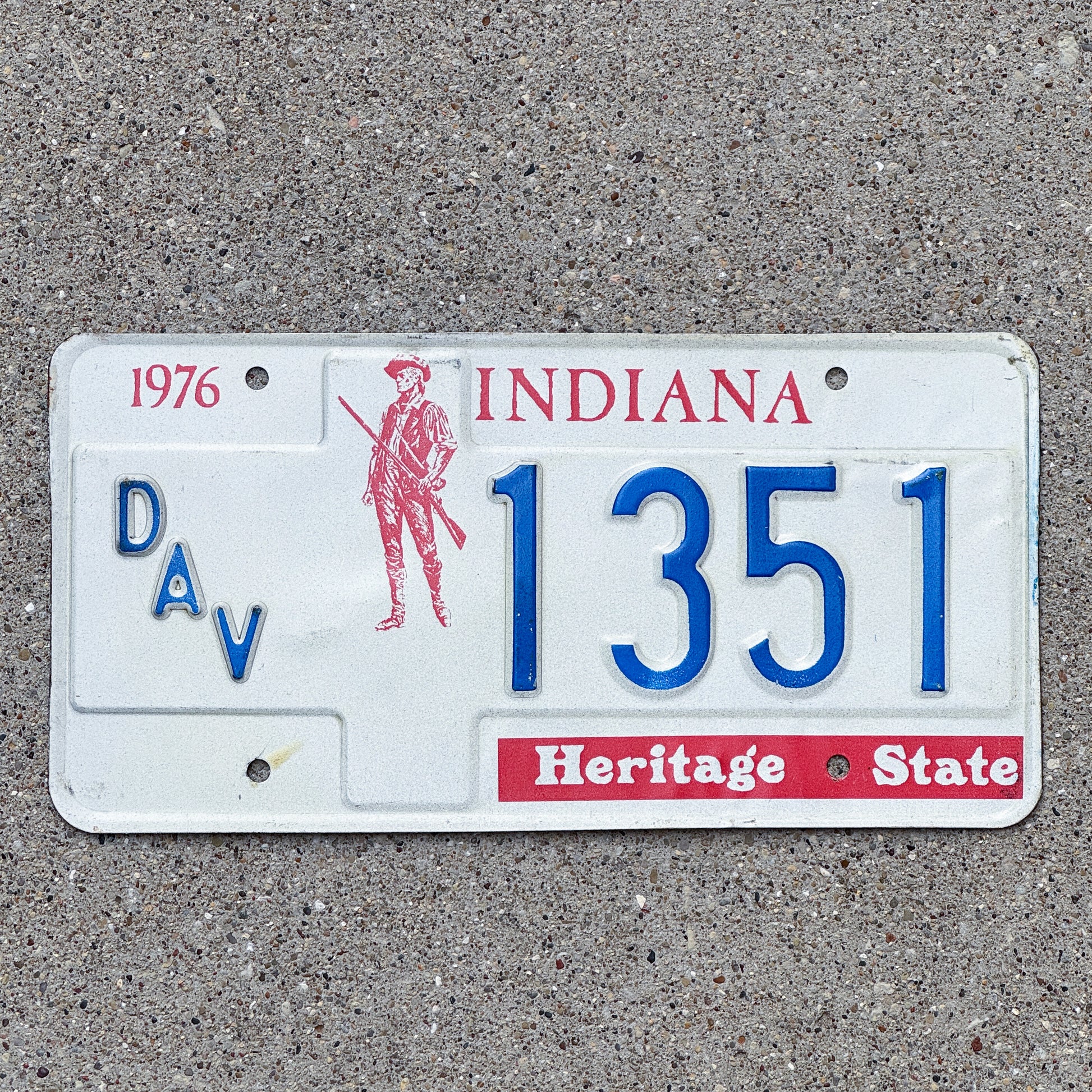 Photo of a 1977 Indiana Disabled Veteran License Plate Auto Tag Garage Decor Vintage 1351 with original patina