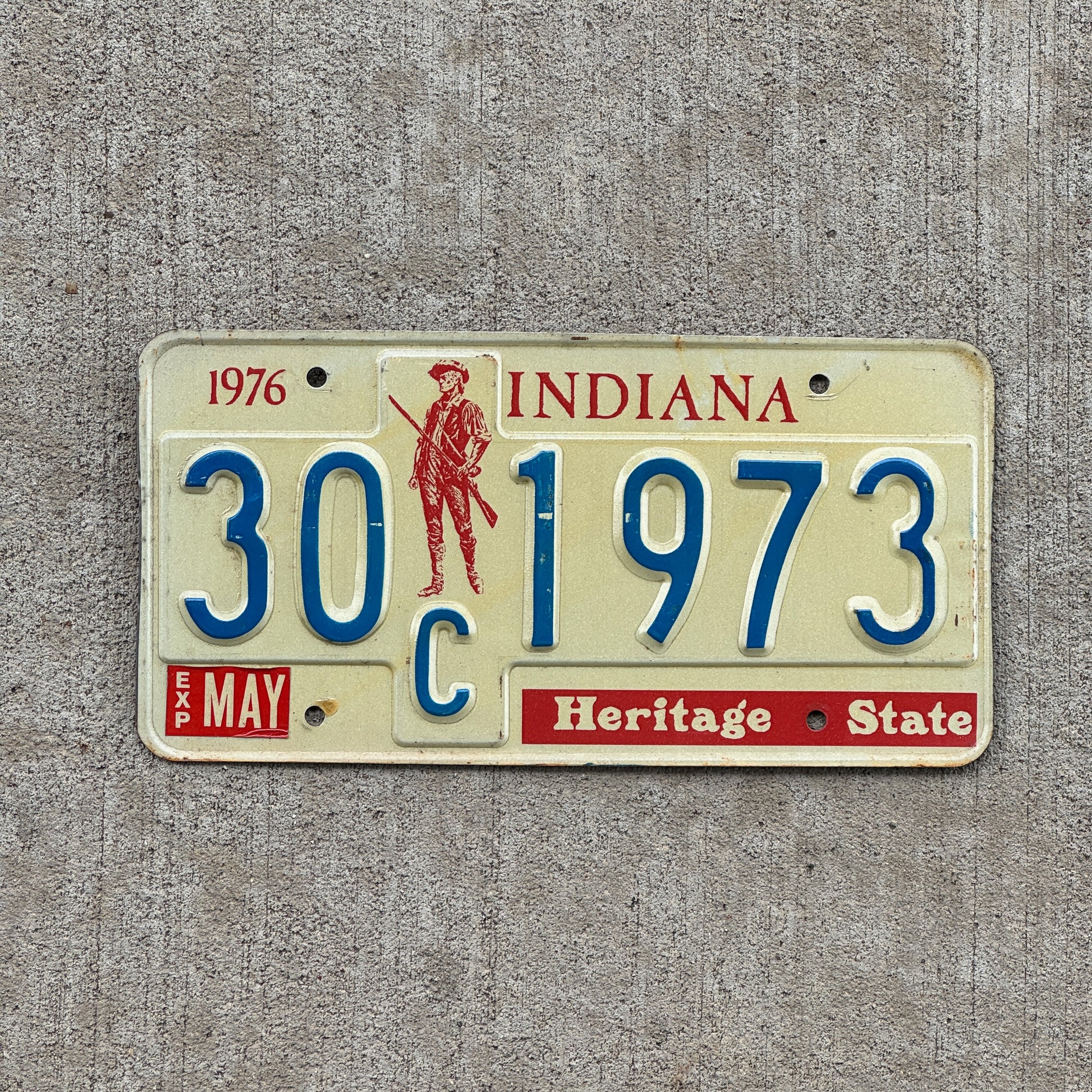 Photo of a 1977 Indiana License Plate Auto Tag Garage Decor Vintage Birth Year 30 C 1973 with original patina