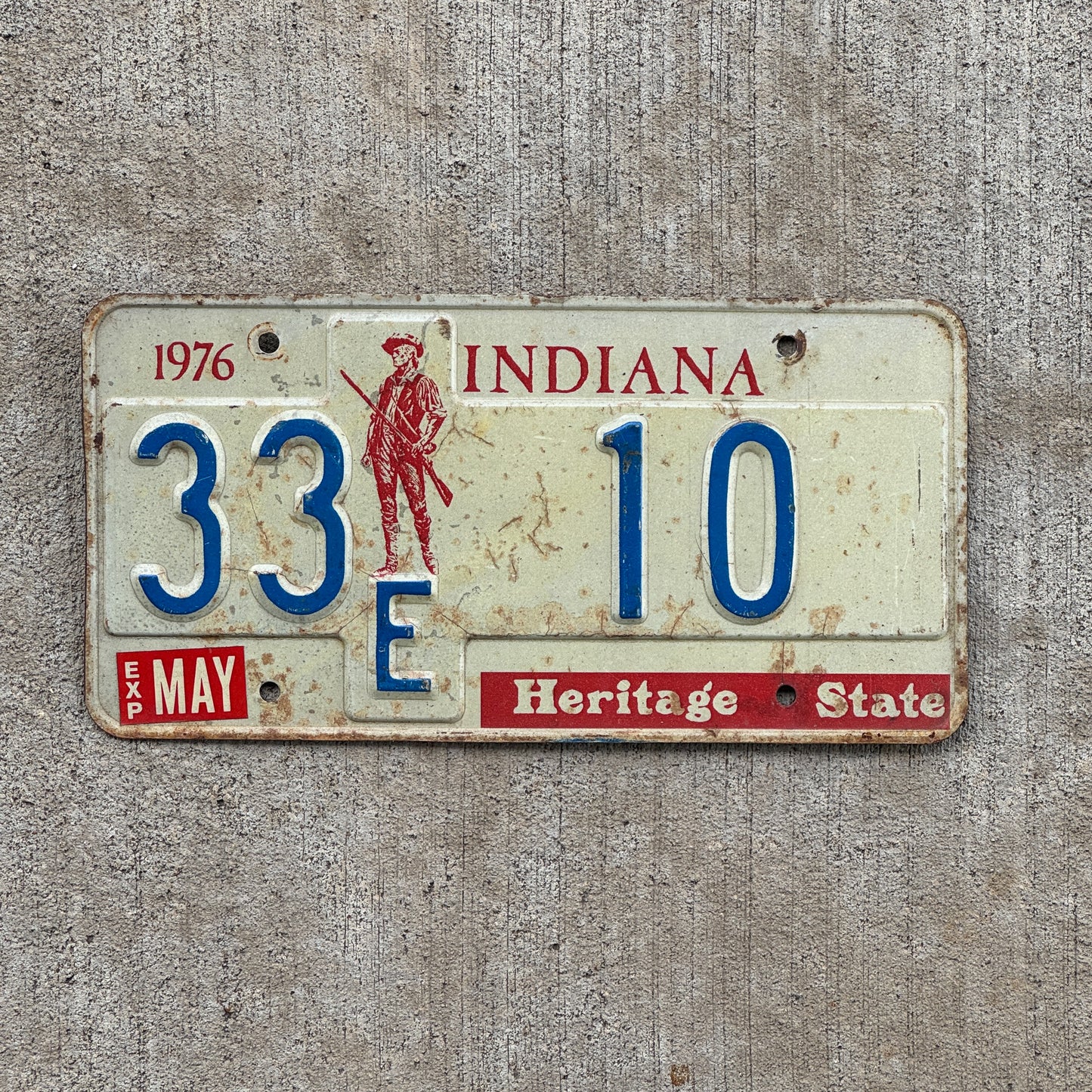 Photo of a 1977 Indiana License Plate Auto Tag Garage Decor Vintage Henry County Low Number 33 F 10 with original patina